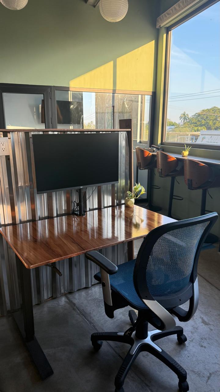 32" monitor on a sit-stand desk